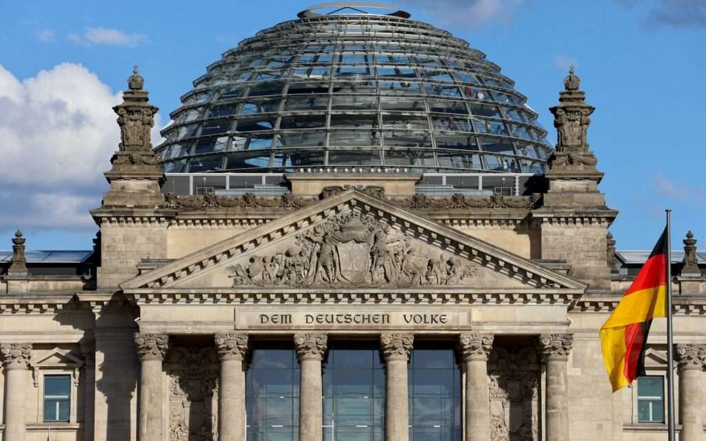 The Reichstag's glass dome above the Dem Deutschen Volke inscription and German flag
